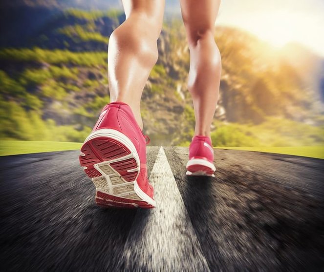 42204183 - legs of sporty woman running on asphalt