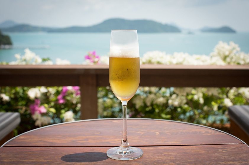 15386484 - a glass of beer with sea background