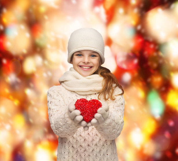 31412501 - charity, happiness and love concept - smiling teenage girl in winter clothes with small red heart