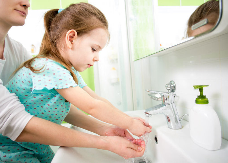 24881615 - kid washing hands with mom