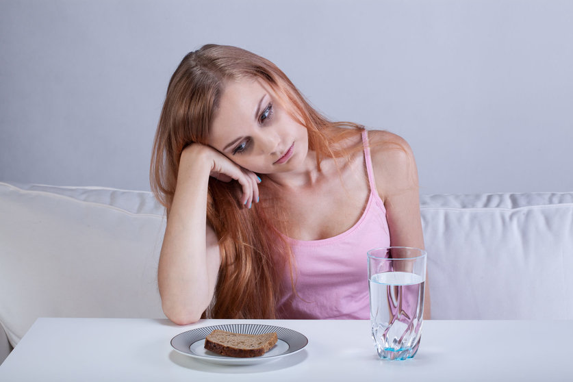 32079251 - portrait of young depressed girl with eating disorder